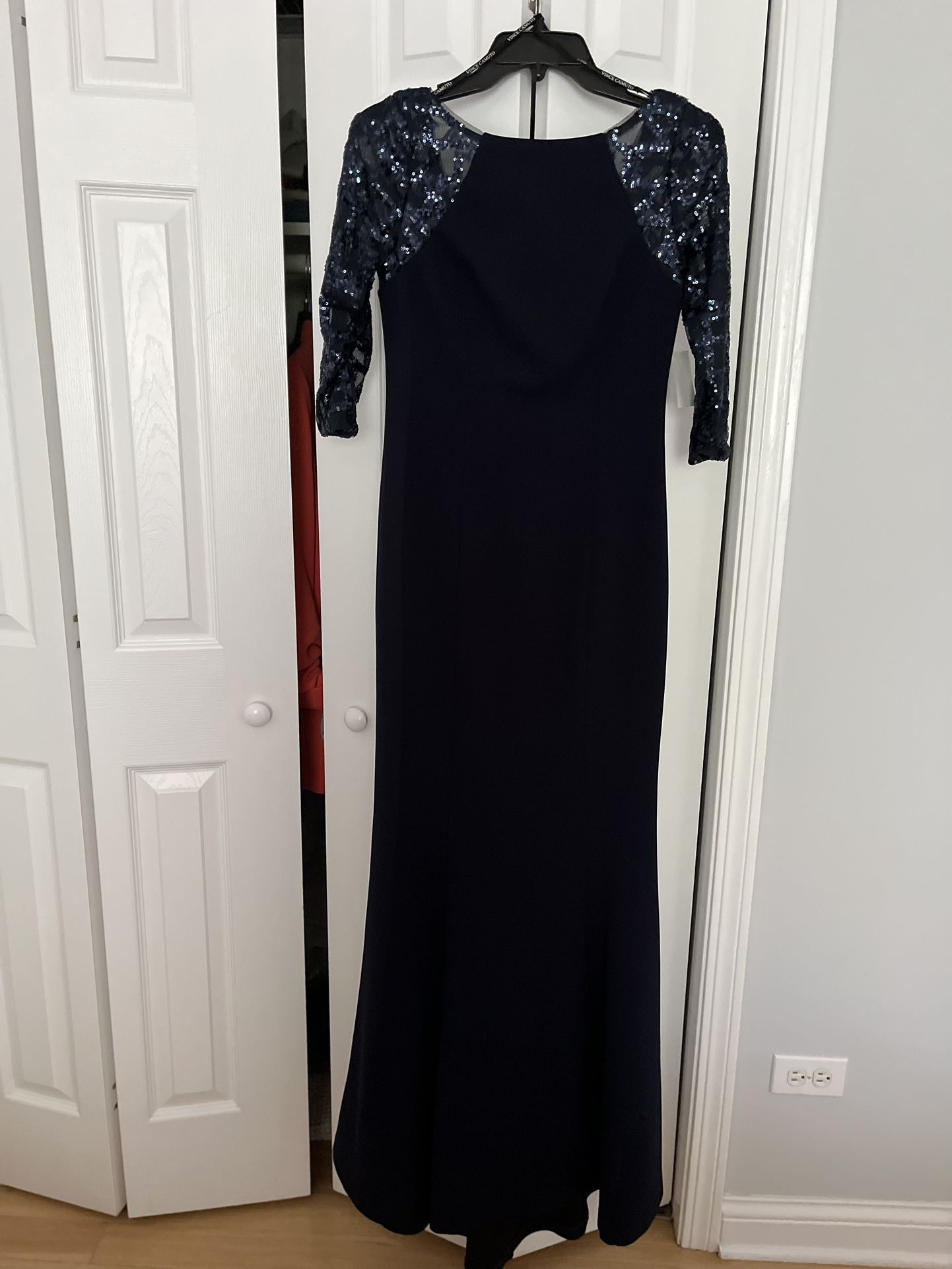 brand new evening gown (brand Vince camuto), size 2 also fits 4, navy blue, sequin sleeves with a light train, open