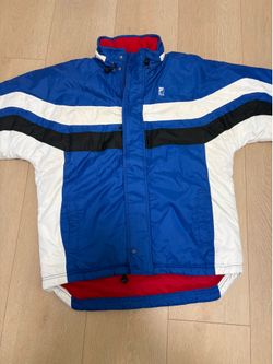 Like new 1990 vintage blue, white, and black Fila colorblock ski jacket with a red lining