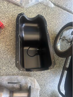 Oil pan board, and black