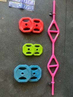T-Grip pink barbell with weight plates