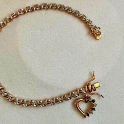 Vintage 925 sterling silver gold cubic zirconia tennis rhinestone bracelet with heart shaped charm  Approx 7.75” length  In great condition