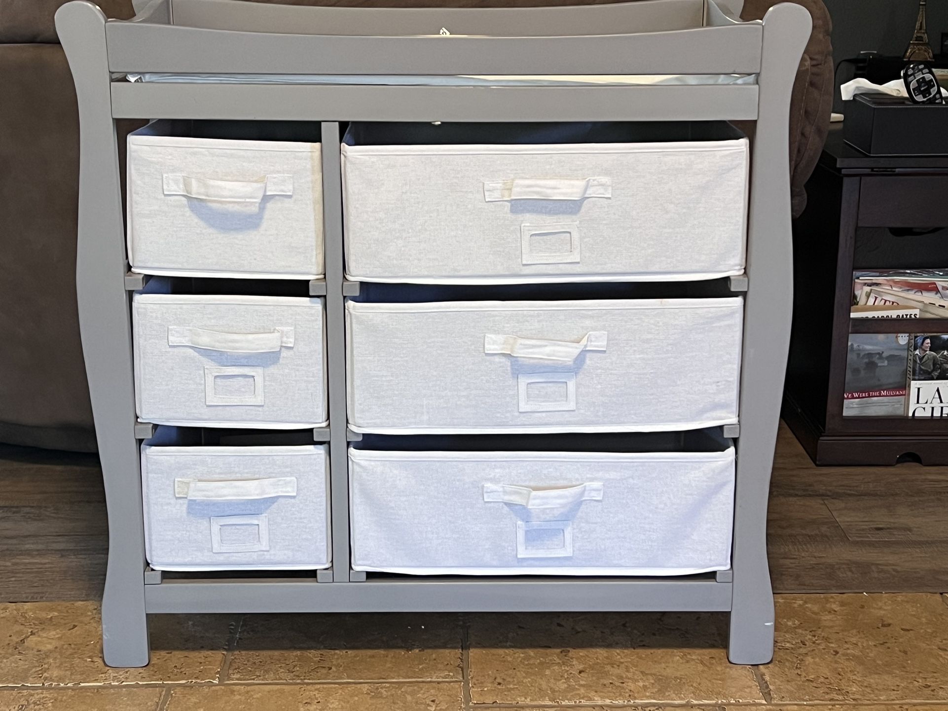 Gray changing table with drawers