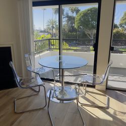 GLASS TABLE WITH 4 CHAIRS 