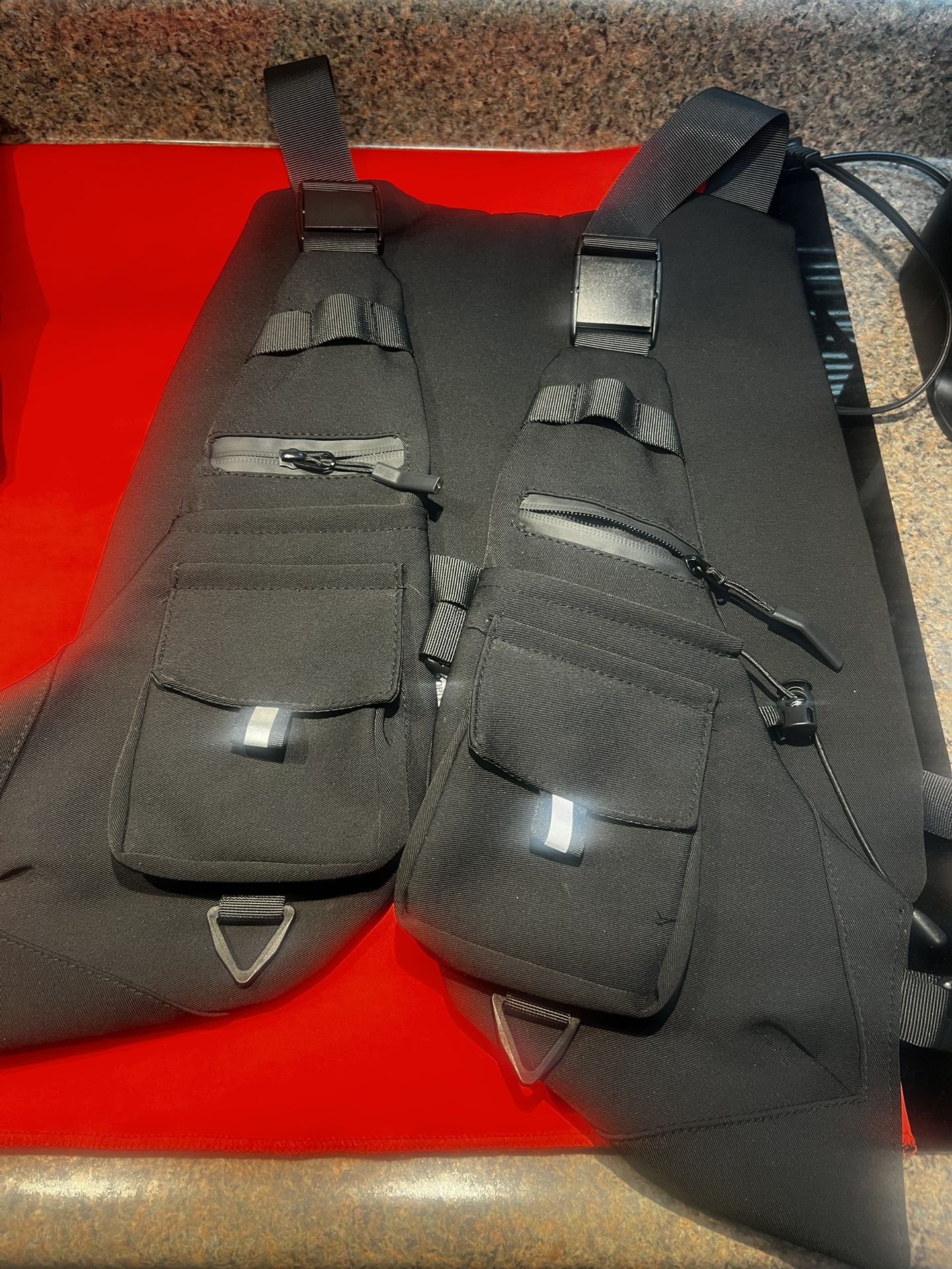 holster/vest, compartments, NEW, adjustable fit for all sizes, very utilitarian item, $49 each
