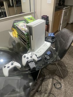 X Box One S and 4 controllers and 16 games and Tower and double controller charger