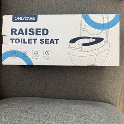 Raised toilet seat