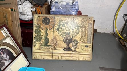 A thick wood picture the papers ripped in the back, but it's in decent shape and it's very heavy