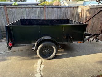 Utility trailer with swing open gate and ramp