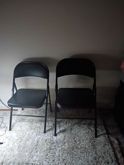 2 Black folding chairs