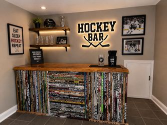 One of a kind Bar made out of Hockey Sticks, includes the 3 bar stools