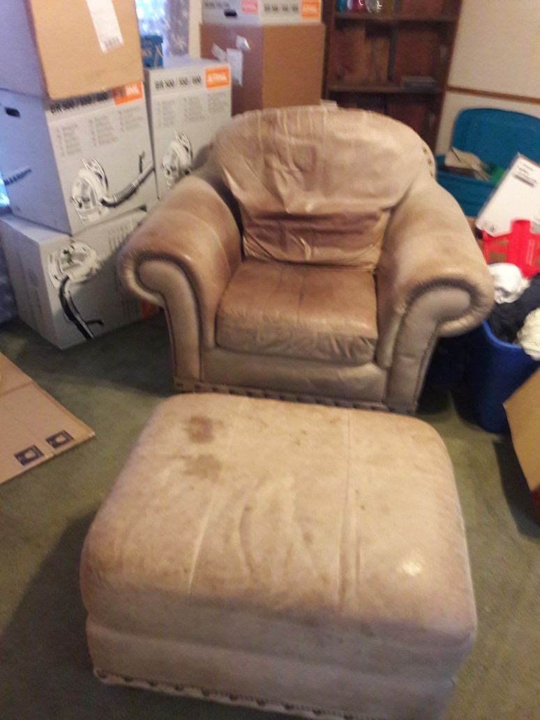 Used leather overstuffed chair and ottoman.