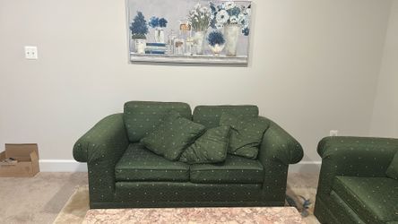 Dark green couch and loveseat