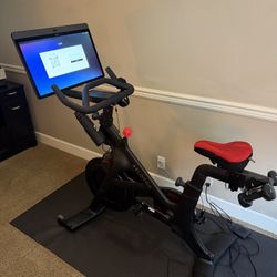 Peloton Bike + with LOTS of accessories, 2 pairs of shoes, weights, mats, blocs, foam rollers
