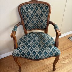 Louis XV style cabriolet armchair with a concave back and overstuffed seat cushion