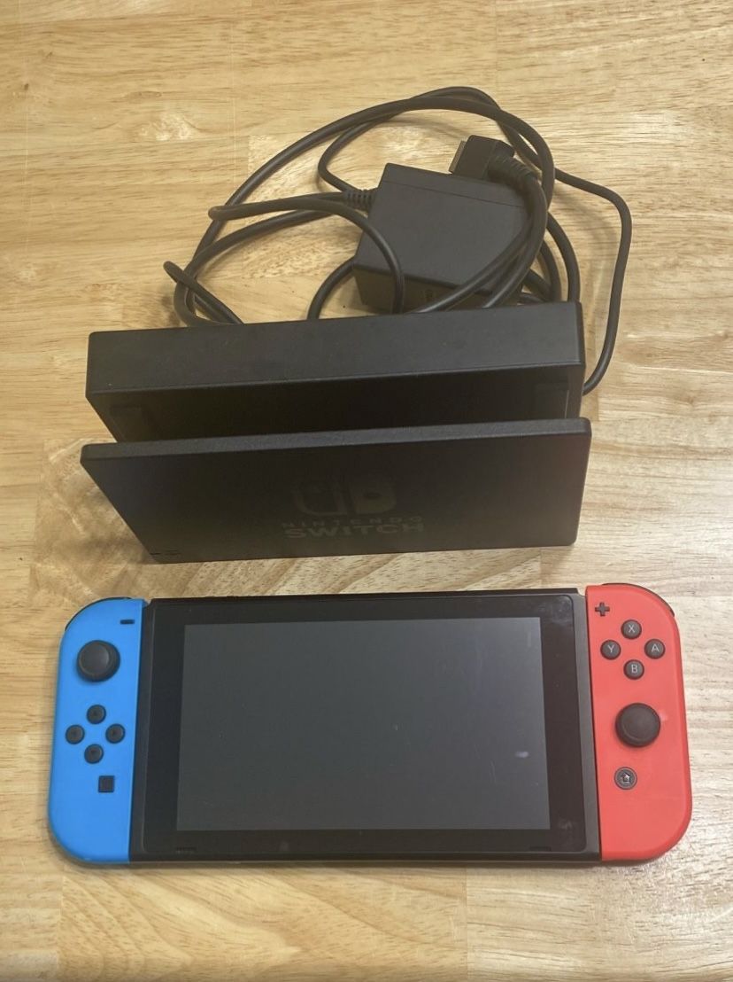 Nintendo Switch w/ Games (pictured) Included