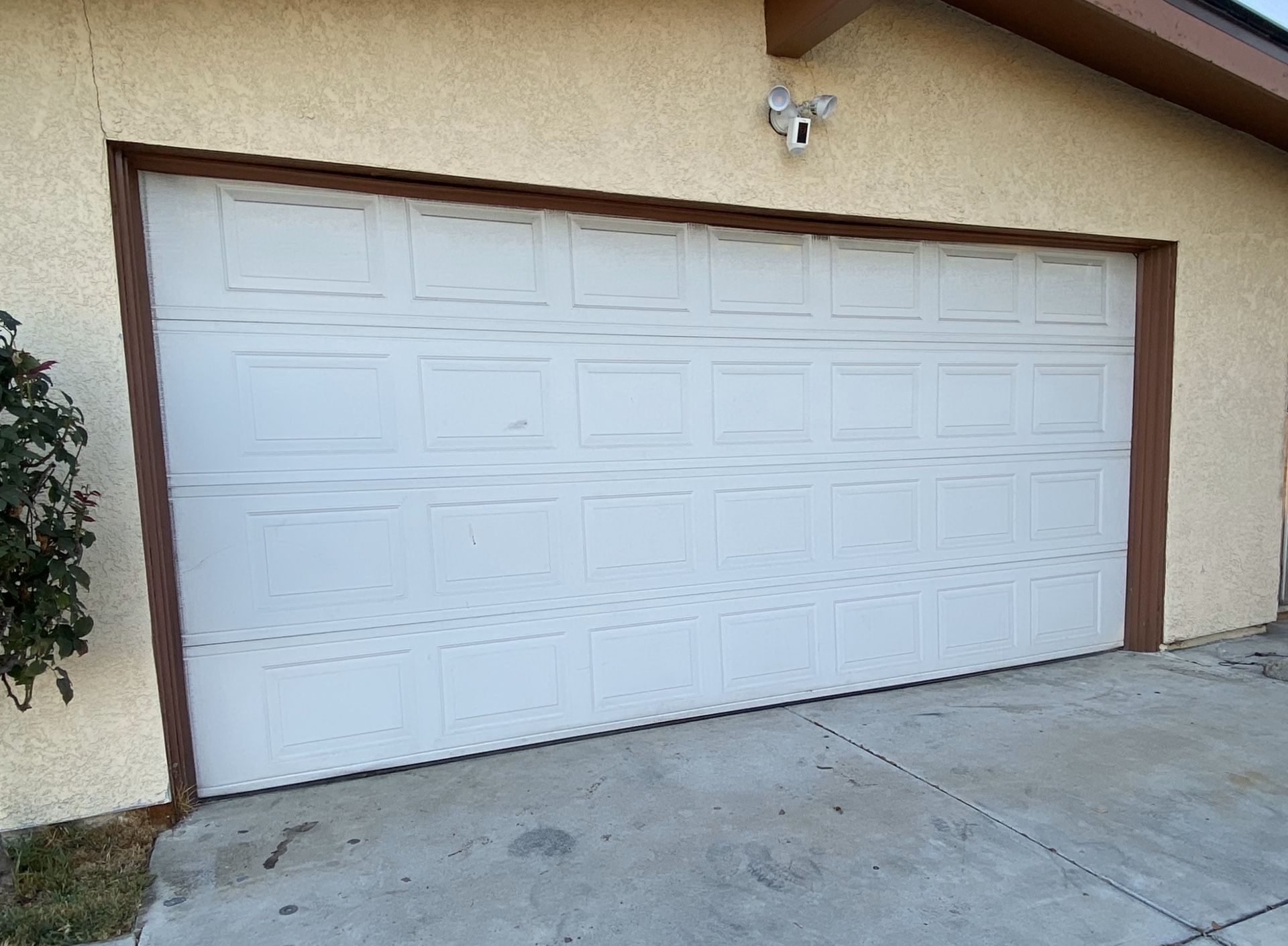 Garage door with Genie opener and hardware.