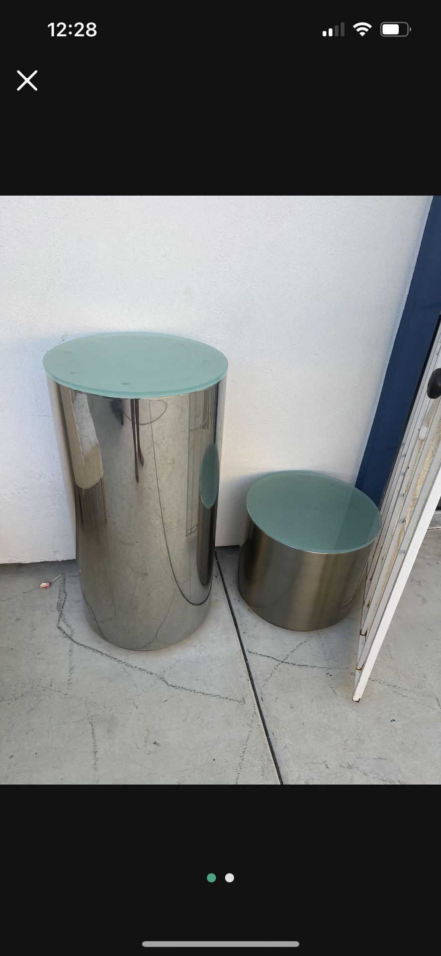 polished aluminum or chrome drum side table Owith a glass top,
