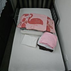toddler bed with mattress and bedding