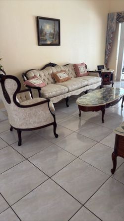 vintage living room set I love seat is sofa and a queen chair. It comes with three beautiful tables.