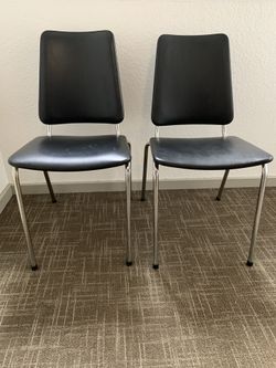 Two vintage mid century retro 50s 60s black vinyl and chromed steel dining room chairs produced at A. Norsy in Haugesund, Norway