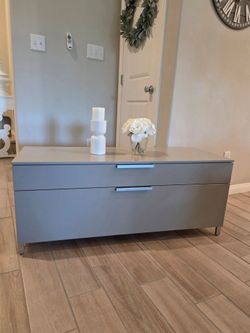 Modern Small-Low Profile Media Console with a sleek grey finish and silver-toned metal handles. Used, in good condition. Normal Wear!

47"W x 17.5"D x