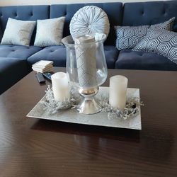 Silver tray with candles.