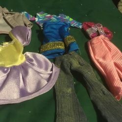 6 Small Babie Doll Clothes For Sale For Just 4.00  Two Tops One Jacket   One Dress Purple With Yellow   Two Pant One Pink One Jean   One Pair Of Short
