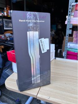 Hand-Held Clip Steamer used