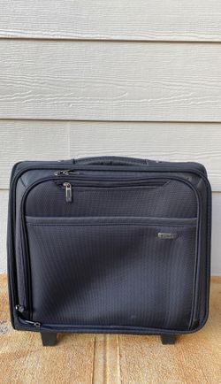 Rolling brief case with laptop sleeve