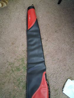 Red and black vinyl soft rifle case.