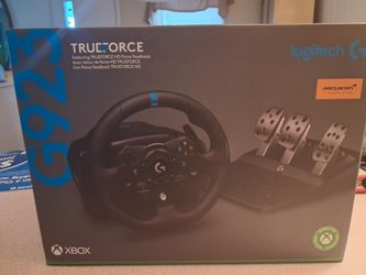 New Logitech G923 racing wheel and pedals set. This black racing peripheral has TRUEFORCE high-definition force feedback technology. It is compatible 
