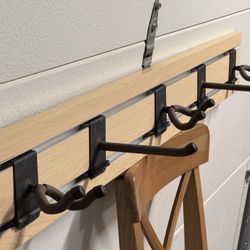 String Swing slatwall with guitar hangers and hooks