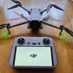 DJI Mini 3 (w/DJI RC) Drone w/3 batteries + charger, hard case, two 128GB SD cards.