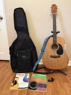 Guitar with Bag, strap, tuner, & books