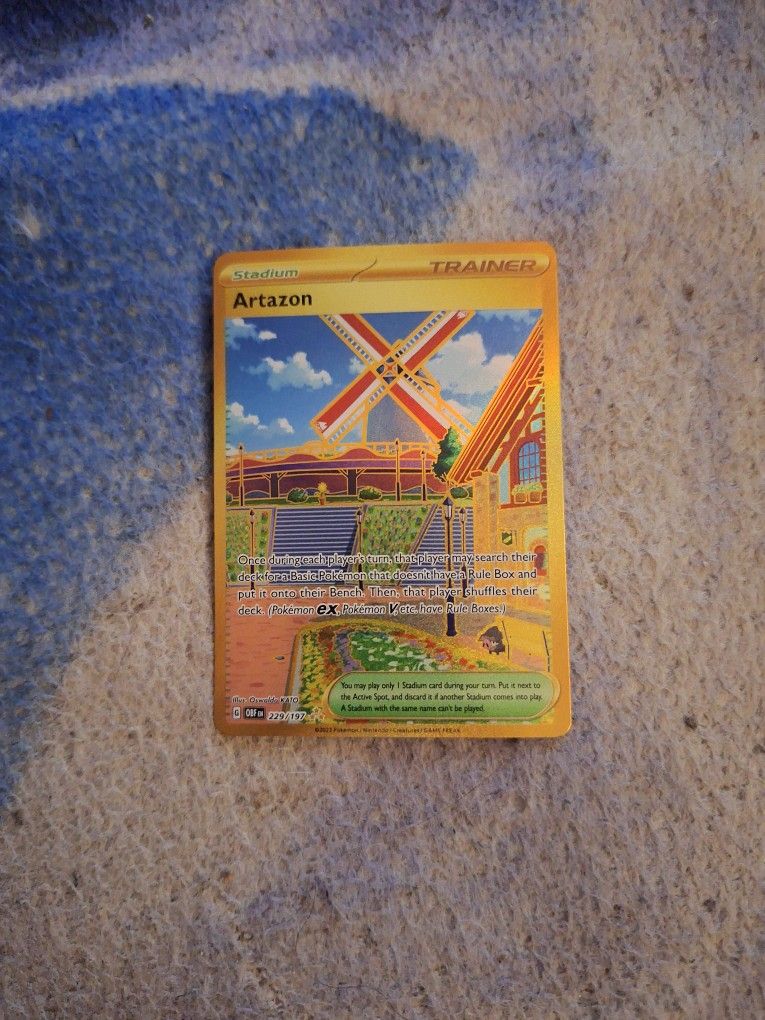 Gold holographic Artazon Pokémon Trainer Card 