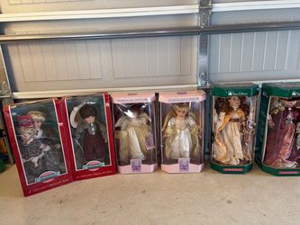 collection of six vintage 16-inch porcelain dolls in their original boxes from brands like Collectible Memories and Trim A Home