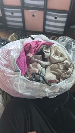 Bag full of clothes to extra small, small and medium
