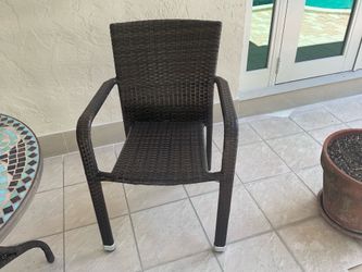 Outdoor plastic chairs plus outdoor table.