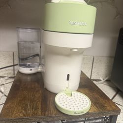 Nespresso Machine With A Bunch Of Pods And Organizer 