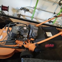 Two Commercial Grade Lawn Mowers with low hours