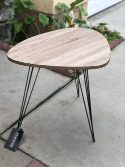 Brand new mid century style end table. Retails for $250