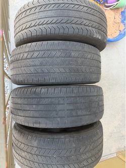 Set of 4 Chevy rims and good tread tires