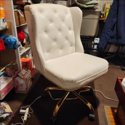 Minor scuffs nothing major. No rips white tufted desk chair