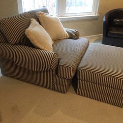 Oversized chair and ottoman. Cream white and black stripe. Recently reupholstered.