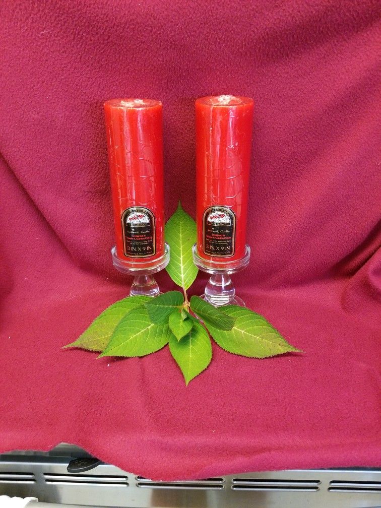 Set Of 2 Pillar Candles Atop Glass Holders