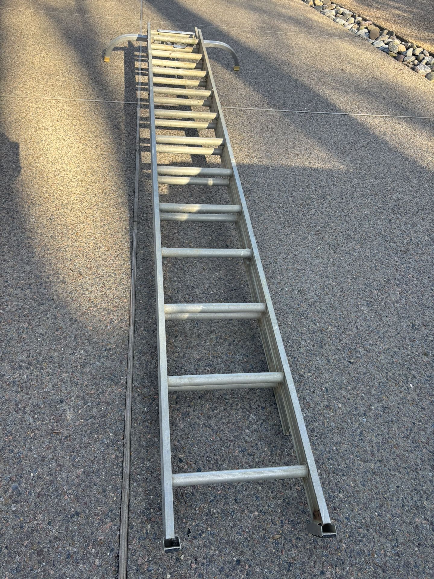 24’ Aluminum Extension Ladder w/stabilizer, end covers