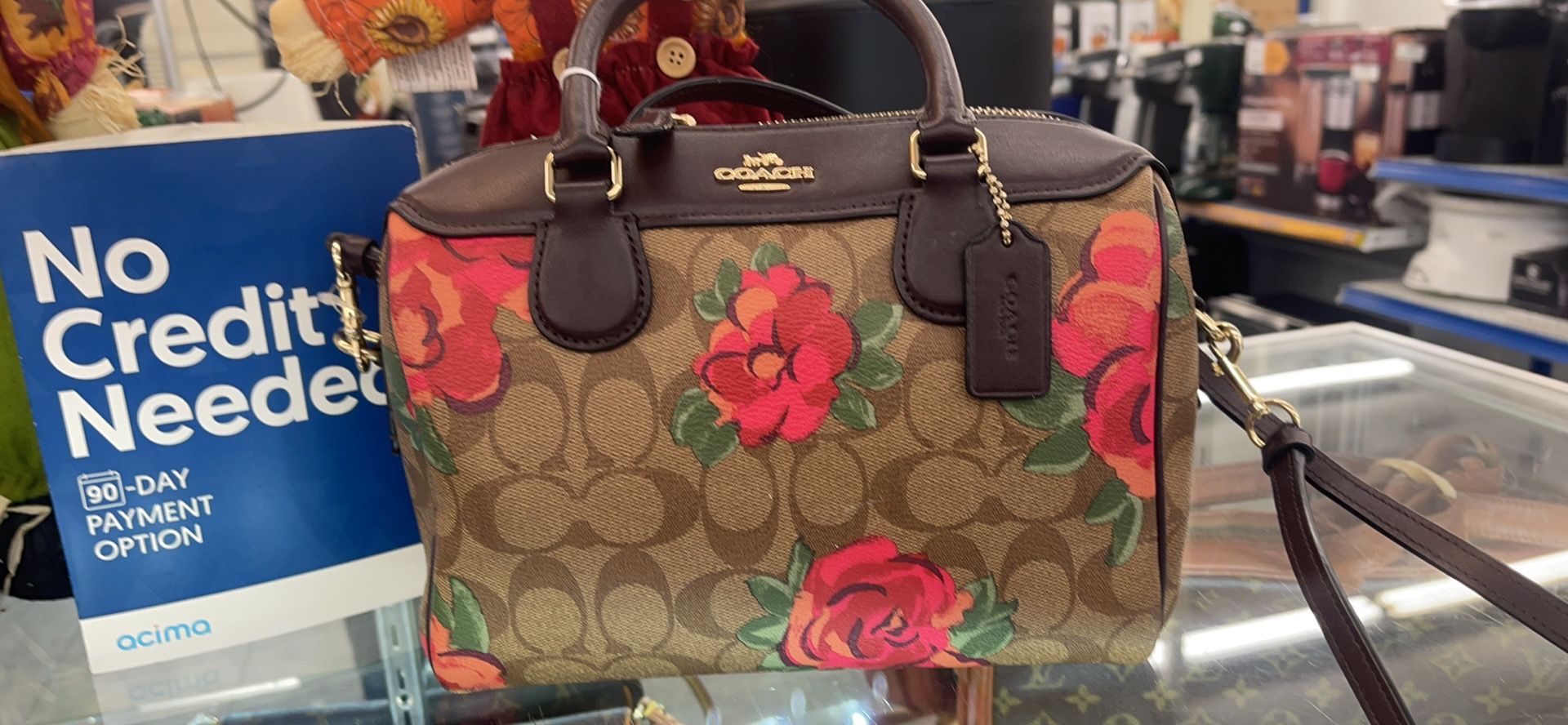Coach purse 👜 Brian with red flowers 🌺 used in good condition 