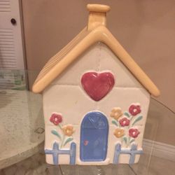 Cookie Jar in the shape of a house, has small chip on chimney.