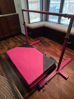 Gymnastics s bars and tumbling mat