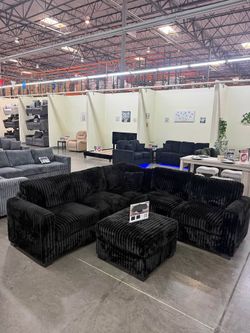 black sectional sofa with ottoman